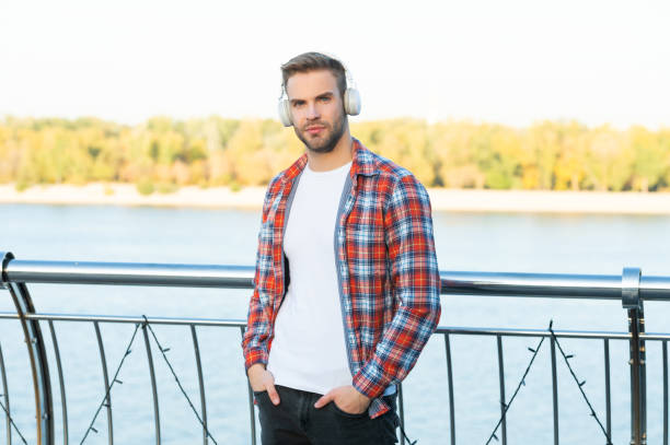 istock modern life. handsome man in casual checkered shirt. 1452467742