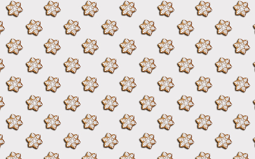 Seamless pattern of cookies in the shape of Snowflake, on a gray background, minimal print for new year card or wrapping paper. Happy new year and merry christmas concept