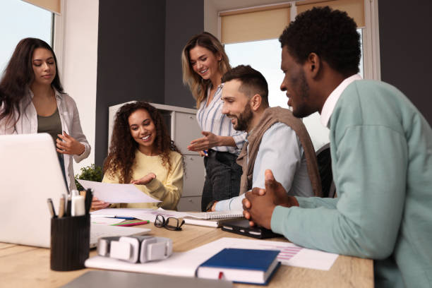 istock Team of employees working together in office. Startup project 1452468795