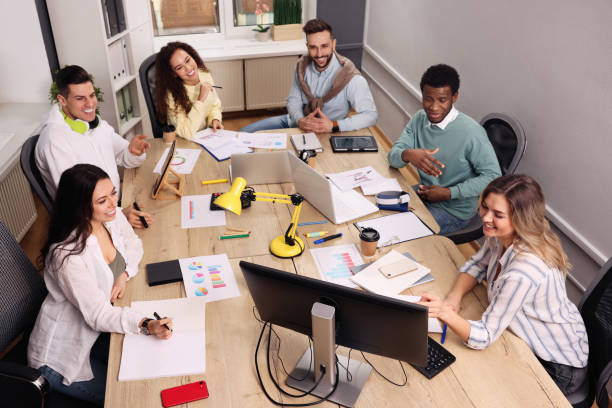 istock Team of employees working together in office. Startup project 1452468796