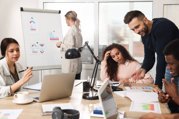 istock Team of employees working together in office. Startup project 1452468852