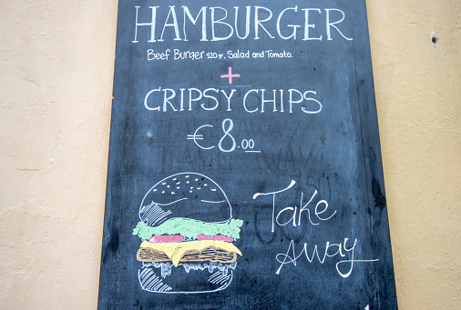 Hamburger & Crispy Chips in Florence at Tuscany, Italy, with a design element visible.