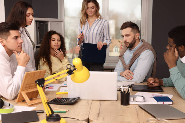istock Team of employees working together in office. Startup project 1452468884