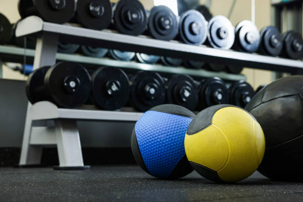 istock Medicine balls on floor in gym, space for text 1452468904