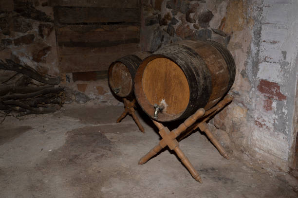 istock wooden barrels for storing wine in the cellar 1452469040