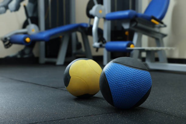 istock Medicine balls on floor in gym, space for text 1452469047