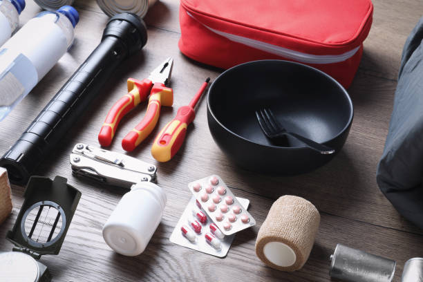 istock Disaster supply kit for earthquake on wooden table 1452469077
