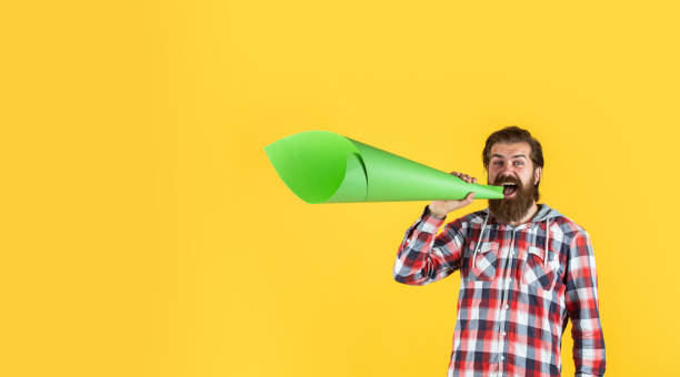 istock mature crazy mad man pose with megaphone. announcement concept. stop being silent. hipster screaming in the megaphone Activist speaks at rally. Make it heard. oratory and rhetoric 1452469220