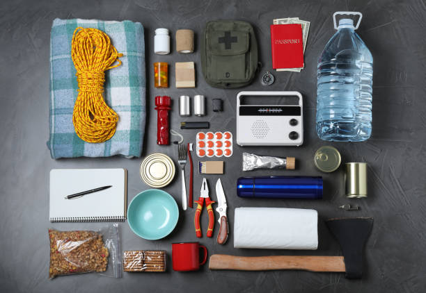 istock Disaster supply kit for earthquake on dark grey table 1452469751