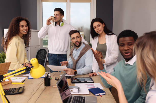 istock Team of employees working together in office. Startup project 1452469812