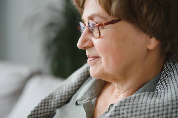 istock Pensive thoughtful middle aged lady looking away sit alone at home feel anxious lonely, sad depressed melancholic old mature woman suffer from sorrow grief thinking of problem suffer from solitude. 1452472290
