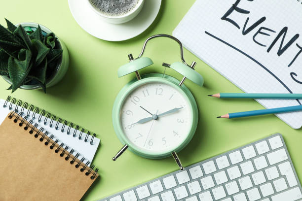 istock Events concept with alarm clock on green background 1452473110