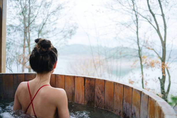 istock Woman relaxing in the outdoor spa 1452473630