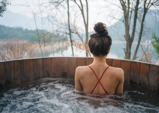 istock Woman relaxing in the outdoor spa 1452473708