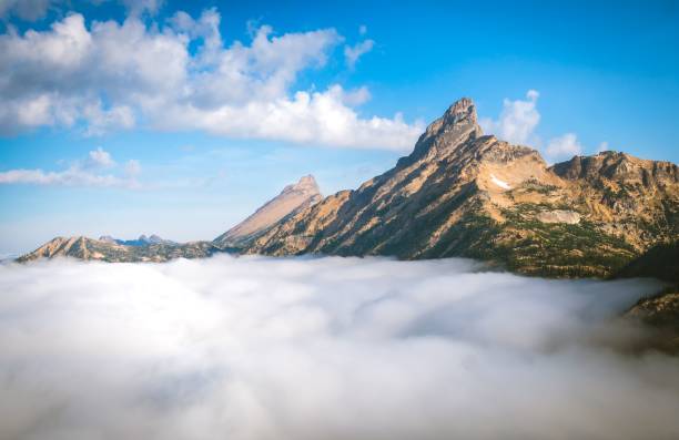 istock Aerial view of mountain landscape surrounded by dense trees 1452476339