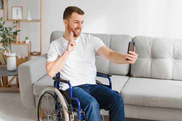 istock Young handsome man in wheelchair 1452476647