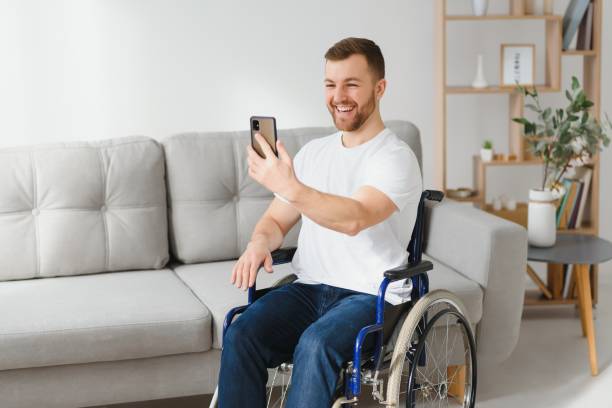 istock Young handsome man in wheelchair 1452476650