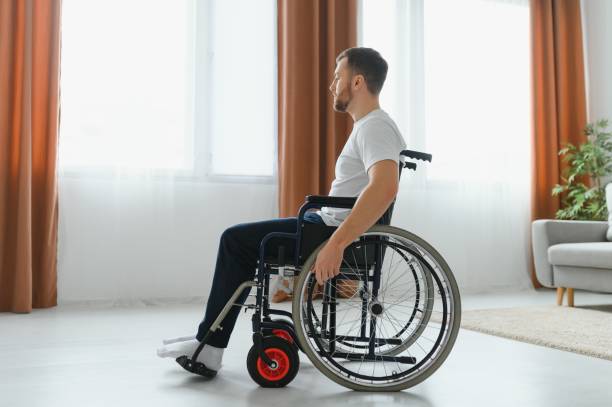 istock Young handsome man in wheelchair 1452477247