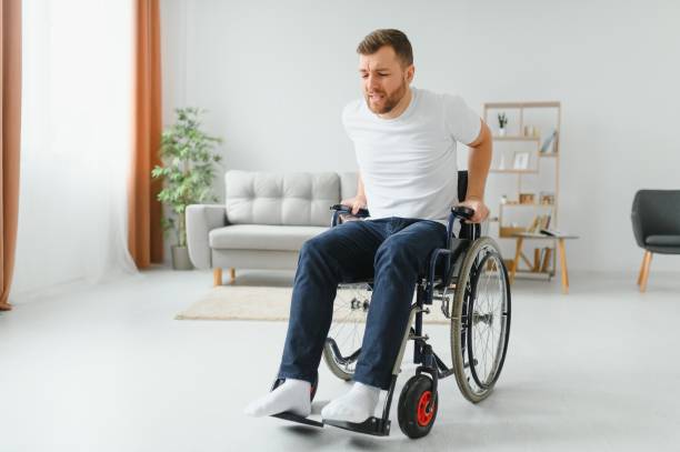 istock Capable disabled trying to get up from the wheelchair 1452477503