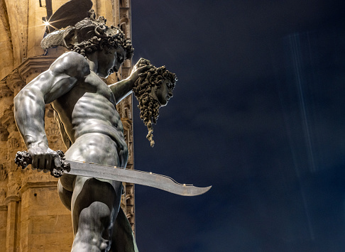Perseus with the Head of Medusa by Benvenuto Cellini at Loggia dei Lanzi on Piazza della Signoria. This sculpture which is in a public space on a town square was built between 1545-1554.