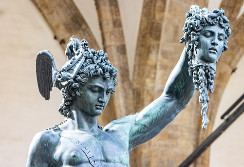 Perseus with the Head of Medusa by Benvenuto Cellini at Loggia dei Lanzi on Piazza della Signoria. This sculpture which is in a public space on a town square was built between 1545-1554.