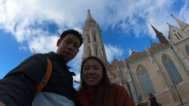 Couple taking selfie at Medieval Buda, Matthias Church