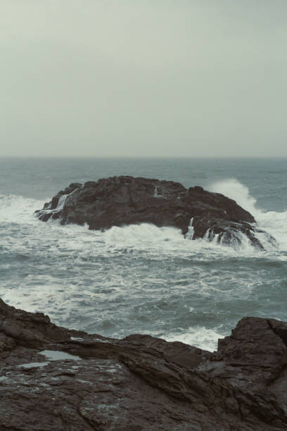istock Large rock in cold sea landscape photo 1452480748