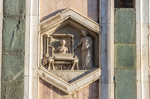 Textile Production by Andrea Pisano, 1334-36 on the exterior of Giotto's Bell Tower in Piazza del Duomo depicts the art of textile production. The woman on the right could be Minerva, the inventor of weaving.