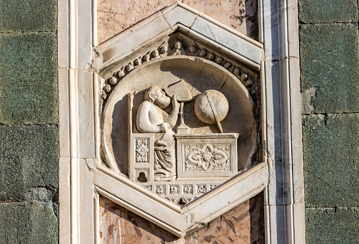 Andrea Pisano (1290-1348) created this on Giotto's Bell Tower (Campanile) to depict Gionitus, the inventor of astronomy (1334-1336). It is on the external wall of the campanile in the public square of Piazza del Duomo