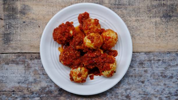 istock Balado Egg, Balado Egg. Traditional spicy fried eggs typically Padang food 1452484106