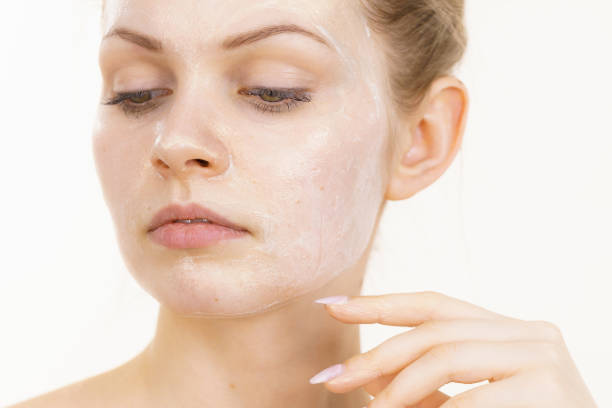 istock Girl with cream moisture cosmetic on face 1452484213
