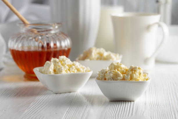 istock Fresh homemade cottage cheese with honey. 1452488843