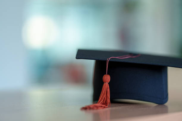 istock Black Graduation Hat placed on wood background 1452491334