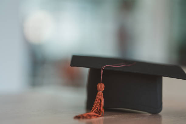 istock Black Graduation Hat placed on wood background 1452491341