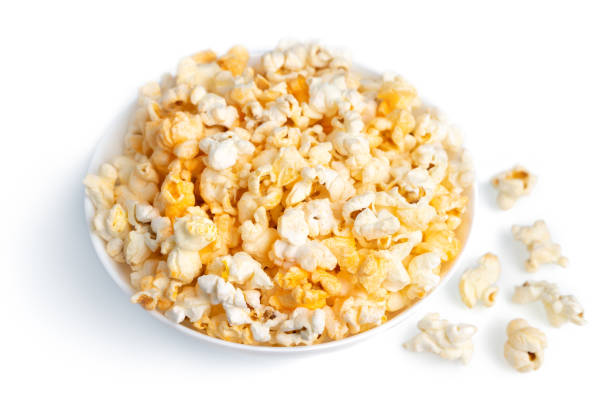 istock Tasty cheese popcorn in bowl isolated on white background close up 1452491513