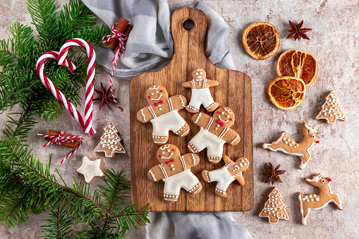 Homemade Christmas gingerbread cookies with Christmas decoration on concrete background