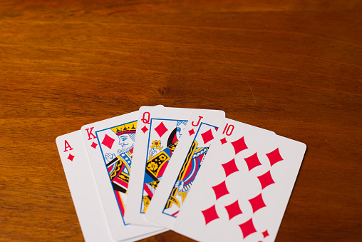 Pinochle hand of diamond and heart cards