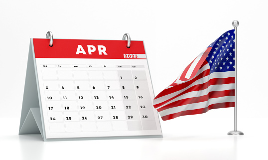 2023 April Calendar And USA Flag On White Background