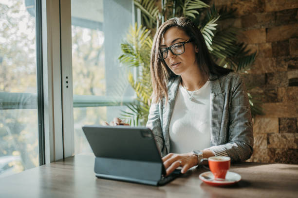 istock Young businesswoman in cafe 1452501215