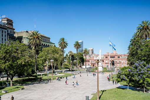 Plaza de Mayo in Buenos Aries. Central square in Buenos Aires with the Argentinean flag in the summer next to the presidential palace. Attractions, travel and tourism in Argentina.