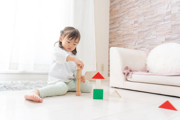Girl playing with toys stock photo