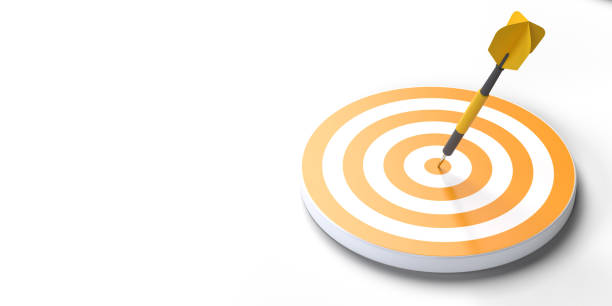 istock Dart hits center of yellow dartboard, high angle view 1452508683