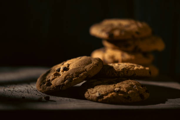 Close up on cookies in the shadow, dark food photography.