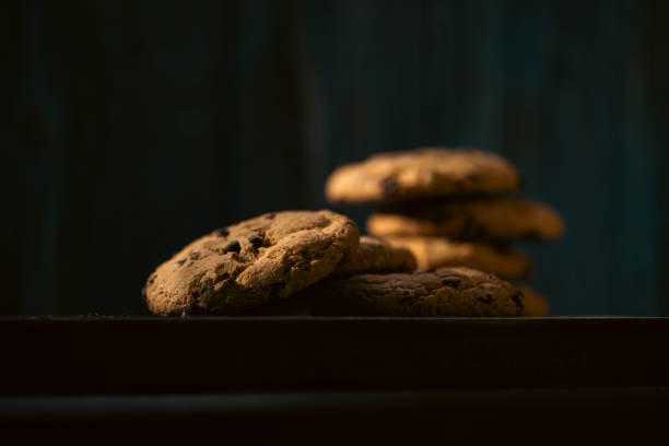 Close up on cookies in the shadow, dark food photography.