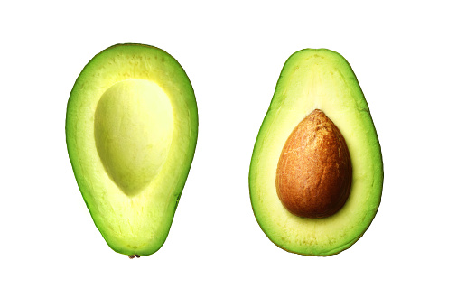 Two slices of avocado isolated on white background.