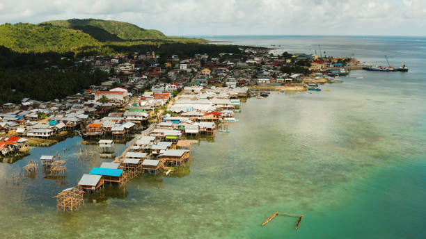 Fishing village and houses on stilts. Dapa city, Siargao, Philippines. stock photo