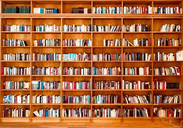 istock Library, fully packed wooden shelves 1452512434
