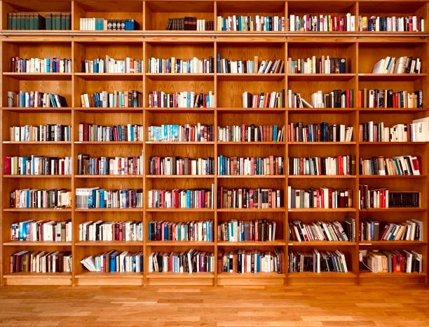 istock Library, fully packed wooden shelves 1452512517