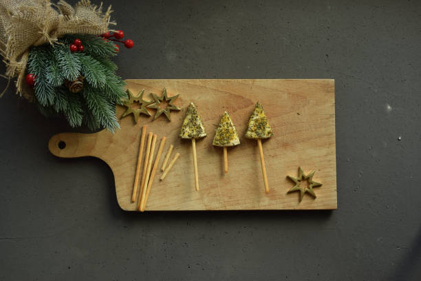 istock Sliced ​​cheese with oregano in a festive meal. 1452523271