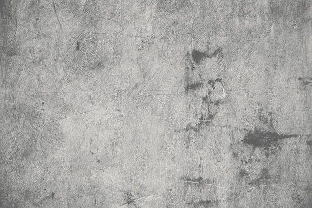 istock Concrete wall with dirty stains and scratches, textured background 1452523955